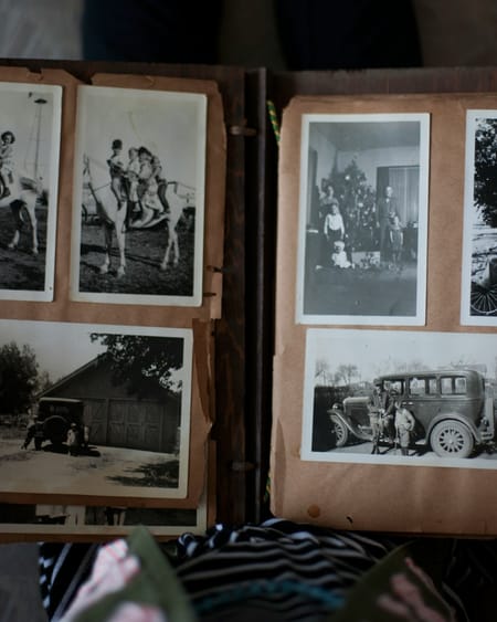 Hands opening a family photo album